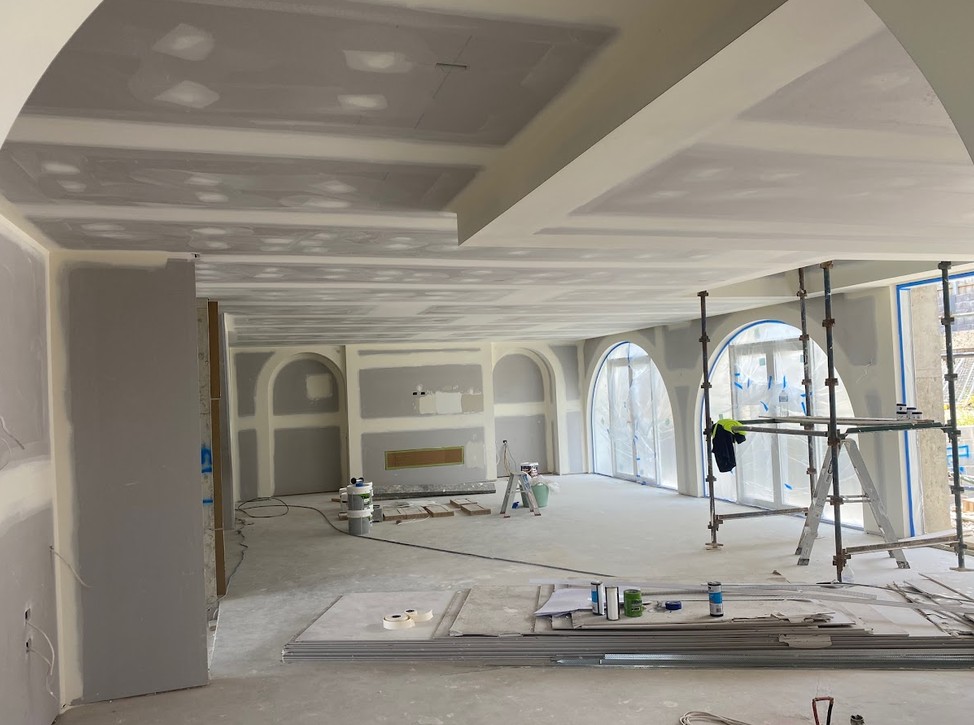Restored Queenslander interior with panelled walls and fireplace