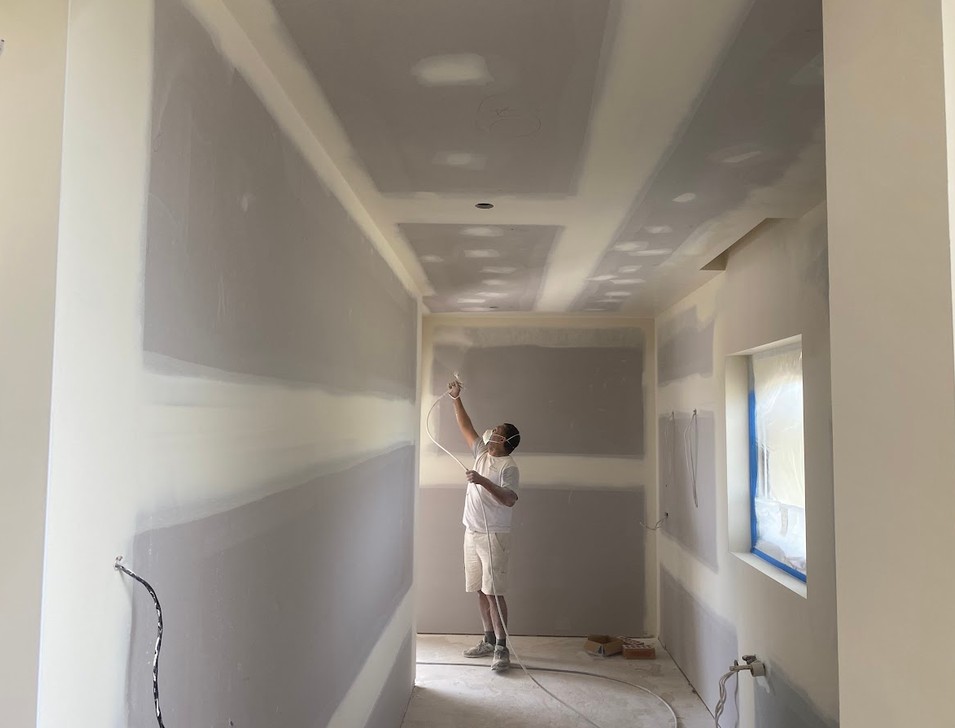 Undercoat going on new residential plasterboard